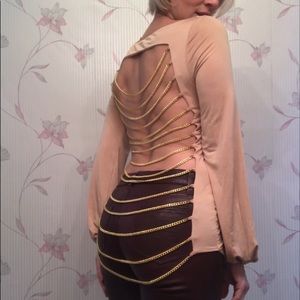 A one of a kind backless top by Savee